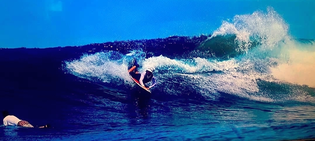 May be an image of 2 people and surfboard