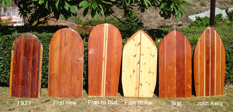 From left to right: 1. 1971. This is one of Bud's oldest boards. It's redwood and cedar. 2. First new. This was the first new board Bud made when he moved from Maui back to Oahu in 2005. 3. Fran to Bud. Bud made this board in honor of his friend legendary surfer Fran Heath. Fran had a solid redwood hot curl board with double pine stringers, so Bud duplicated the look in this paipo board and had Fran sign it. 4. Fran to Kai. Bud made this board out of notty pine and redwood for his nephew, Kai Lyons, and had Fran Heath sign it to Kai. 5. Bud. A redwood and pine board that Bud made for himself. 6. John Kelly. Bud made this board in honor of his friend, legendary surfer John Kelly, who designed the first hot curl board. Bud pulled in the nose of this paipo board to duplicate the look of John's board and to make the board ride better in steeper sections.